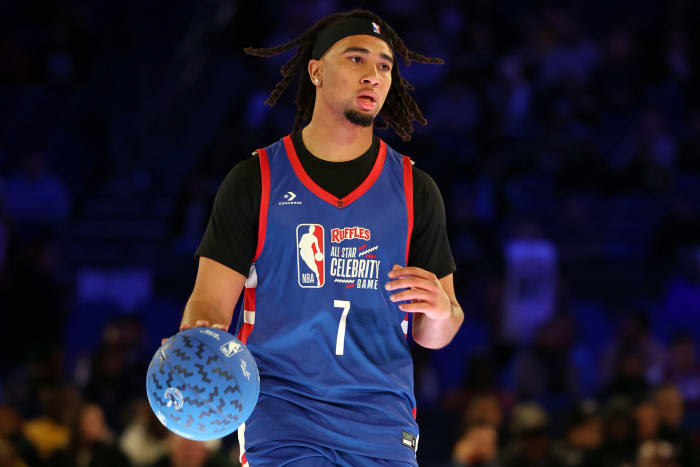 CJ Stroud (7) of Team Stephen A controls the ball against Team Shannon in the first quarter during the All Star Celebrity Game at Lucas Oil Stadium.